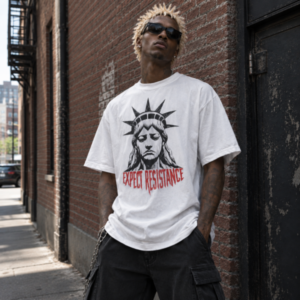 Model wearing white bold expect resistance streetwear tee, front view