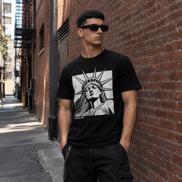 Model wearing black Statue of Liberty graphic tee, front view