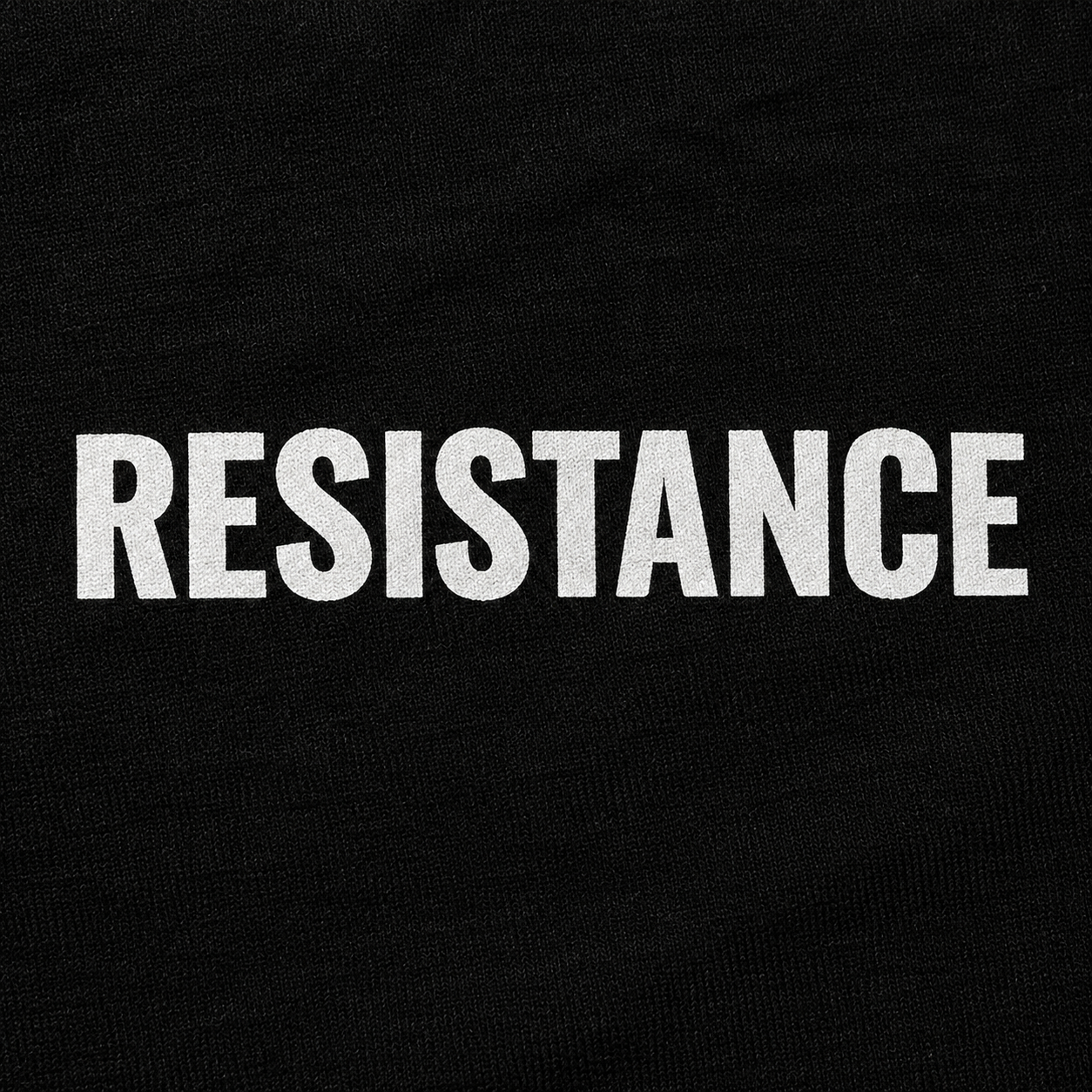 Close-up of a white resistance logo print on a black shirt