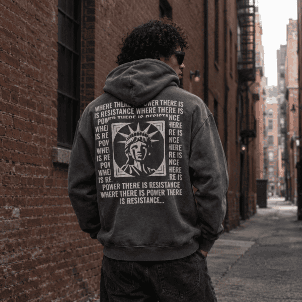 Model wearing storm gray American resistance protest hoodie, back view