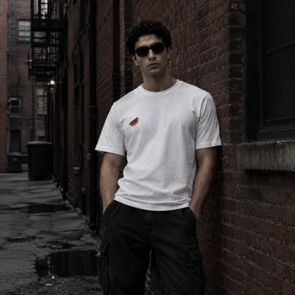 Model wearing white Free Palestine tee, front view
